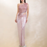 Woman wearing a one-shoulder pink evening gown against a plain background