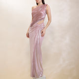 Woman wearing a one-shoulder pink evening gown on a neutral background