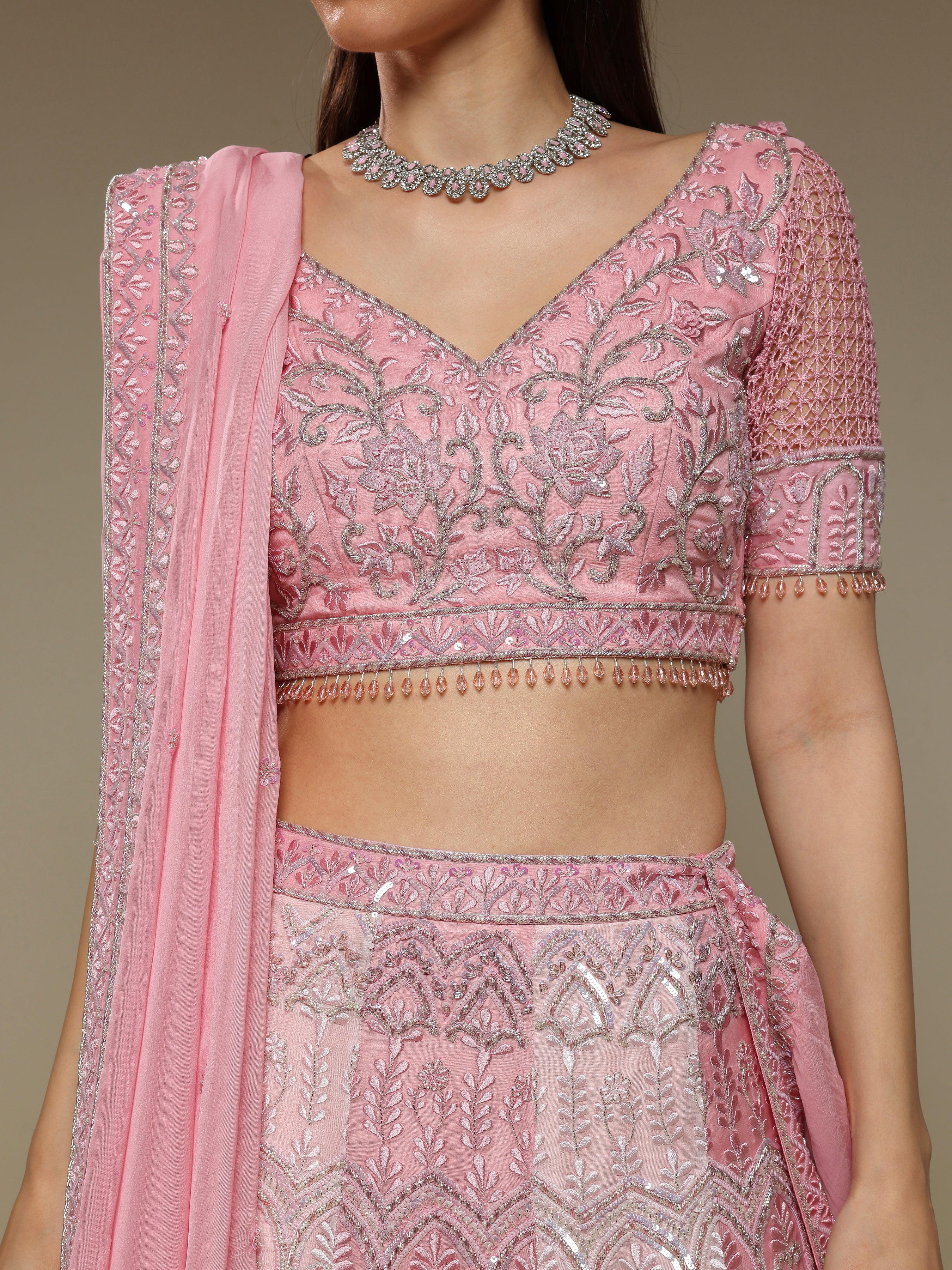 Close-up of jaali and zardozi embroidery on pink blouse and dupatta
