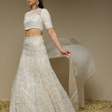 Full ivory lehenga outfit showcasing pearl and threadwork embellishments