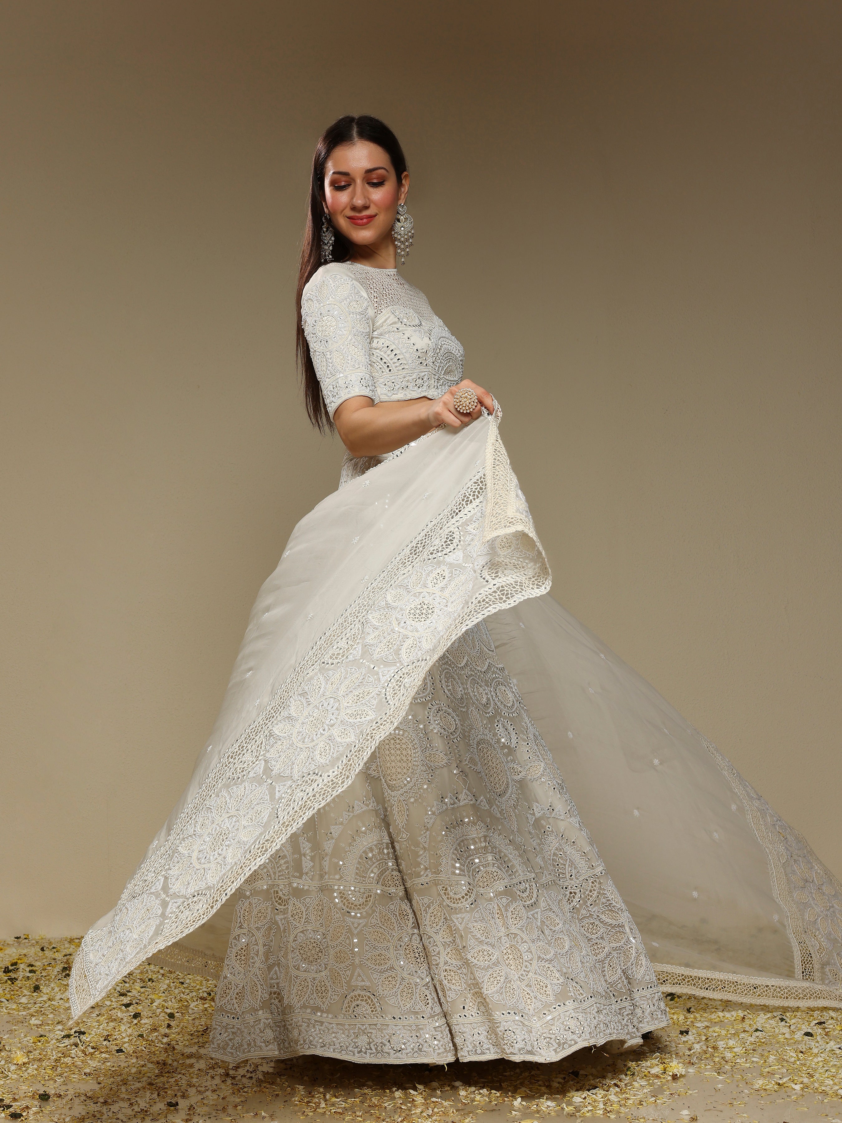 Side view of ivory embroidered lehenga set