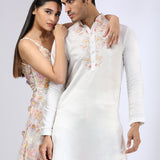Ivory 3-D embroidered gown & Embroidered Ivory Kurta teamed with matching narrow pants