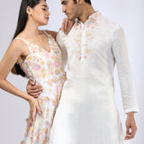 Ivory 3-D embroidered gown & Embroidered Ivory Kurta teamed with matching narrow pants