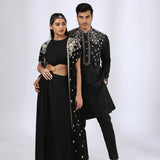 Jet black jumsuit with an embroidered open jacket & Black Embroidered Kurta teamed with matching narrow pants - Couple Set