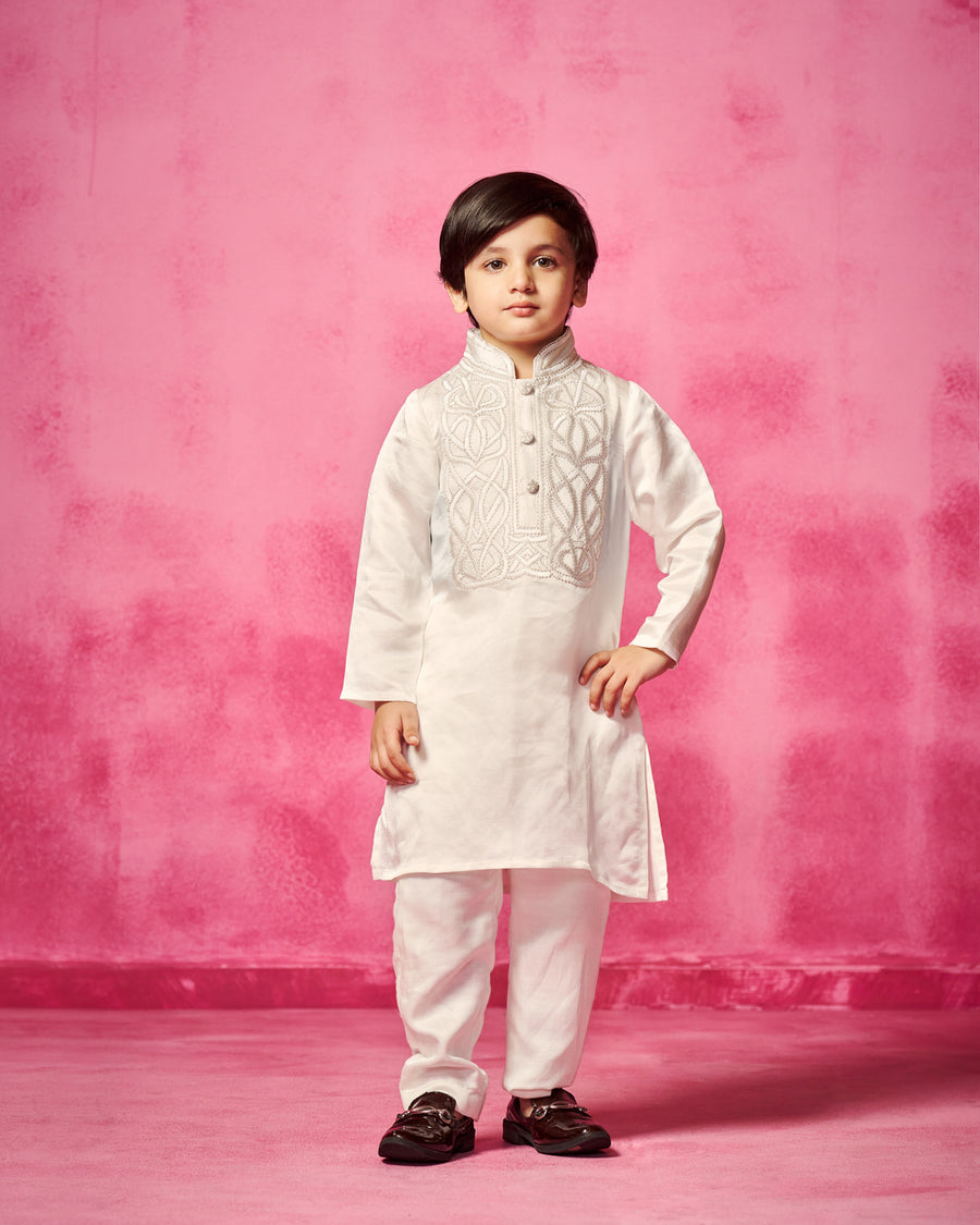 Embroidered Ivory Kurta teamed with matching narrow pants