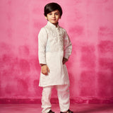 Embroidered Ivory Kurta teamed with matching narrow pants