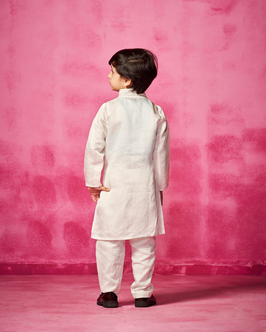 Embroidered Ivory Kurta teamed with matching narrow pants