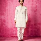 Embroidered Ivory Kurta teamed with matching narrow pants