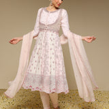 Woman wearing a traditional outfit with a beige background