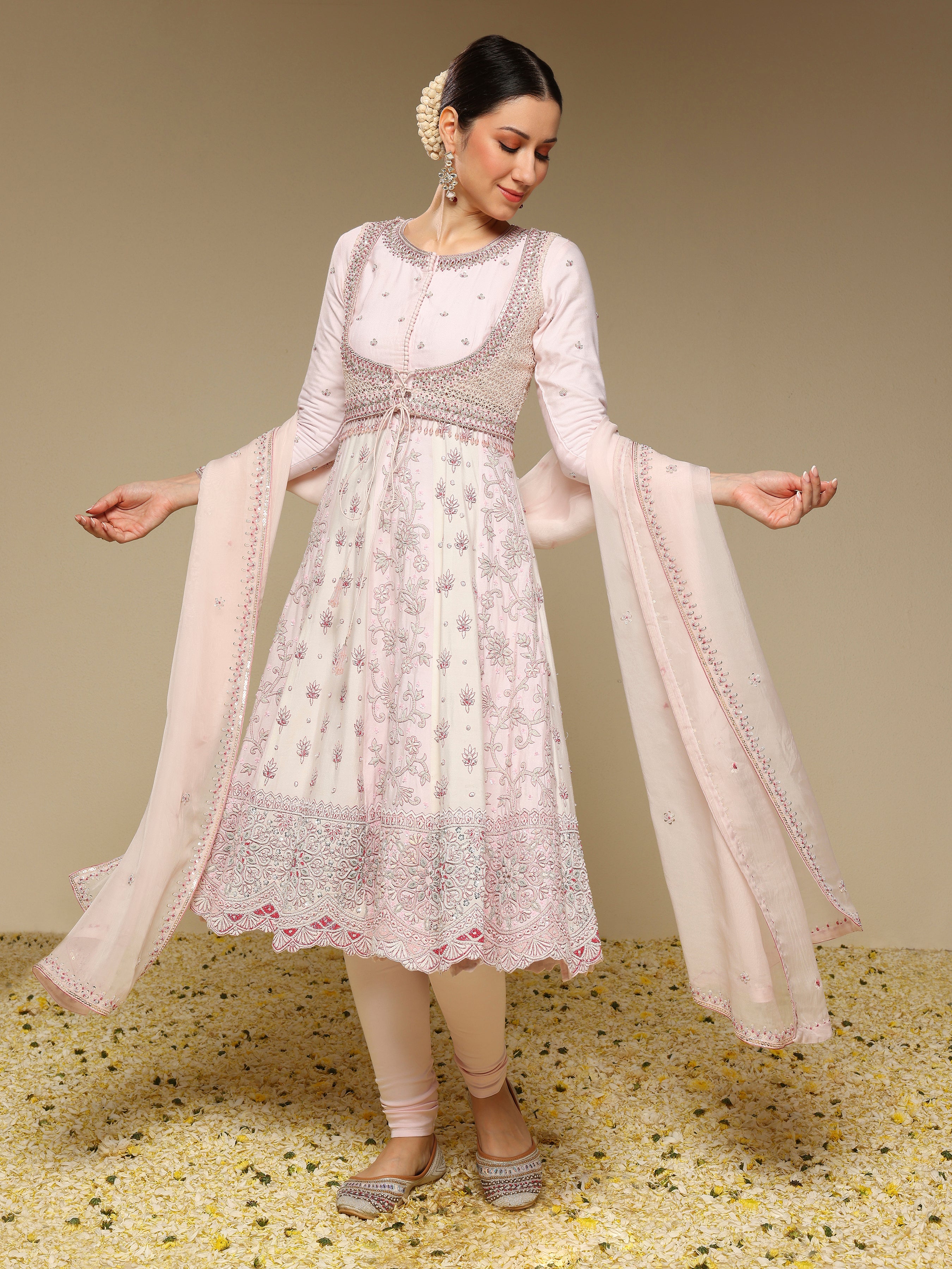 Woman wearing a traditional outfit with a beige background