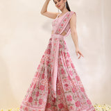Woman wearing a pink floral dress on a light background