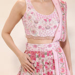 Close-up of thread and sequin embroidery on blouse and waistbelt