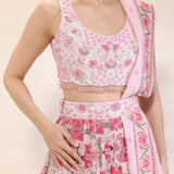 Close-up of thread and sequin embroidery on blouse and waistbelt