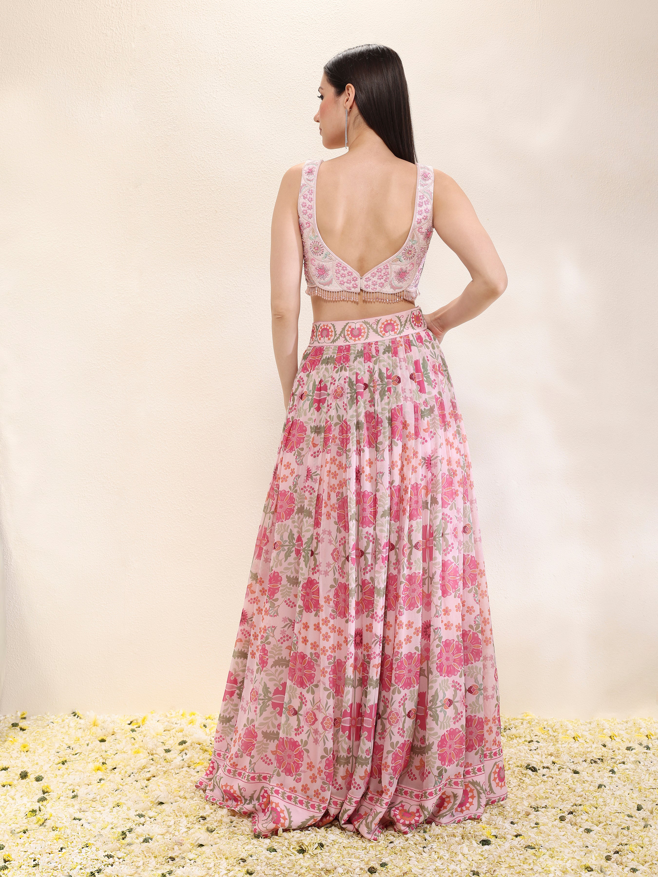Back view of printed georgette lehenga and dupatta with embroidered spun silk blouse