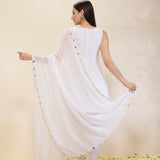 Woman wearing a white dress with a plain background