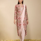 Woman wearing a pre-draped chudidar saree with embroidered jacket