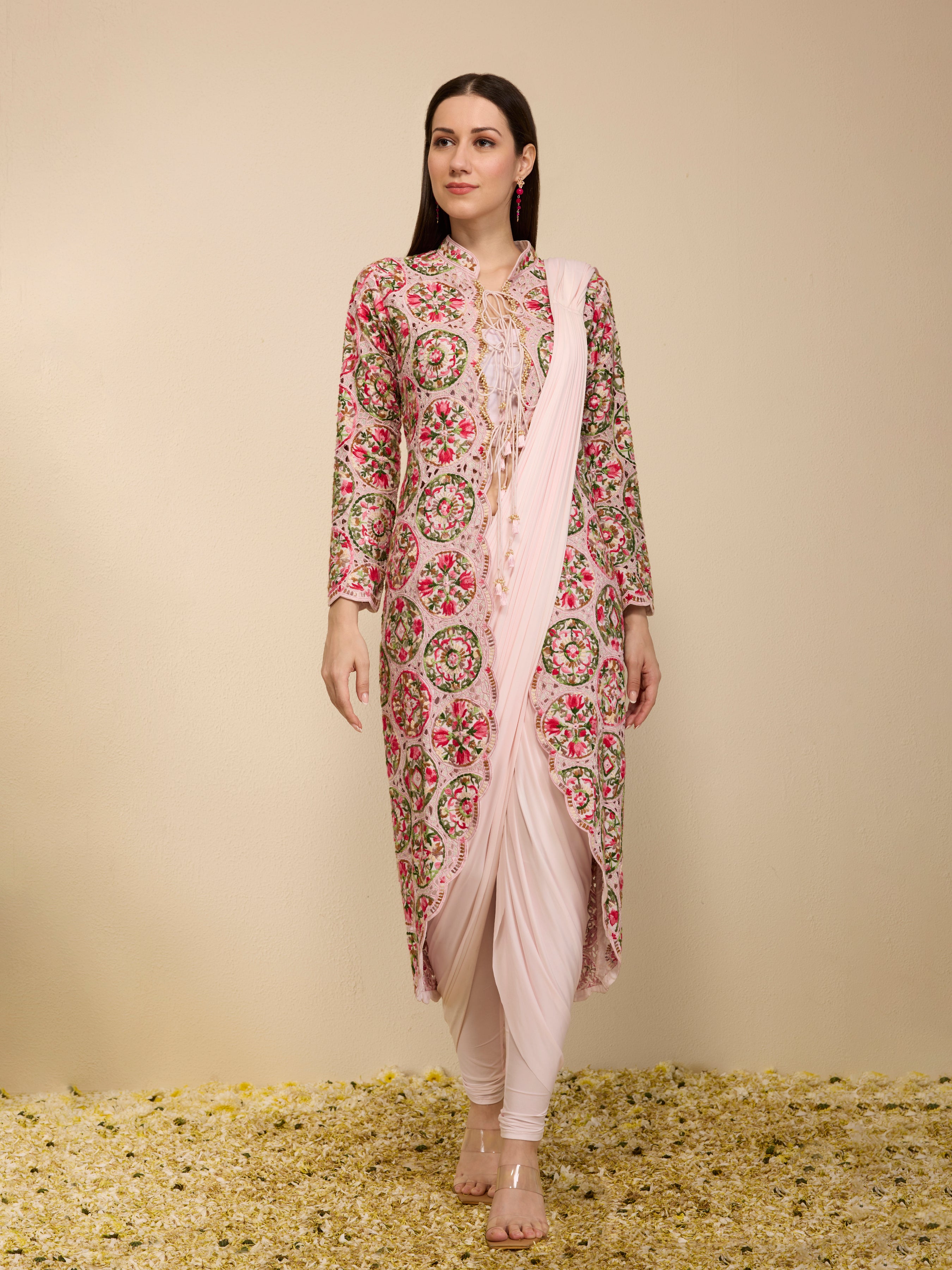 Woman wearing a pre-draped chudidar saree with embroidered jacket