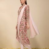 Side view of woman wearing a multi-colored pre draped saree with embroidered jacket