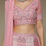 Close-up of jaali and zardozi embroidery on pink blouse and dupatta