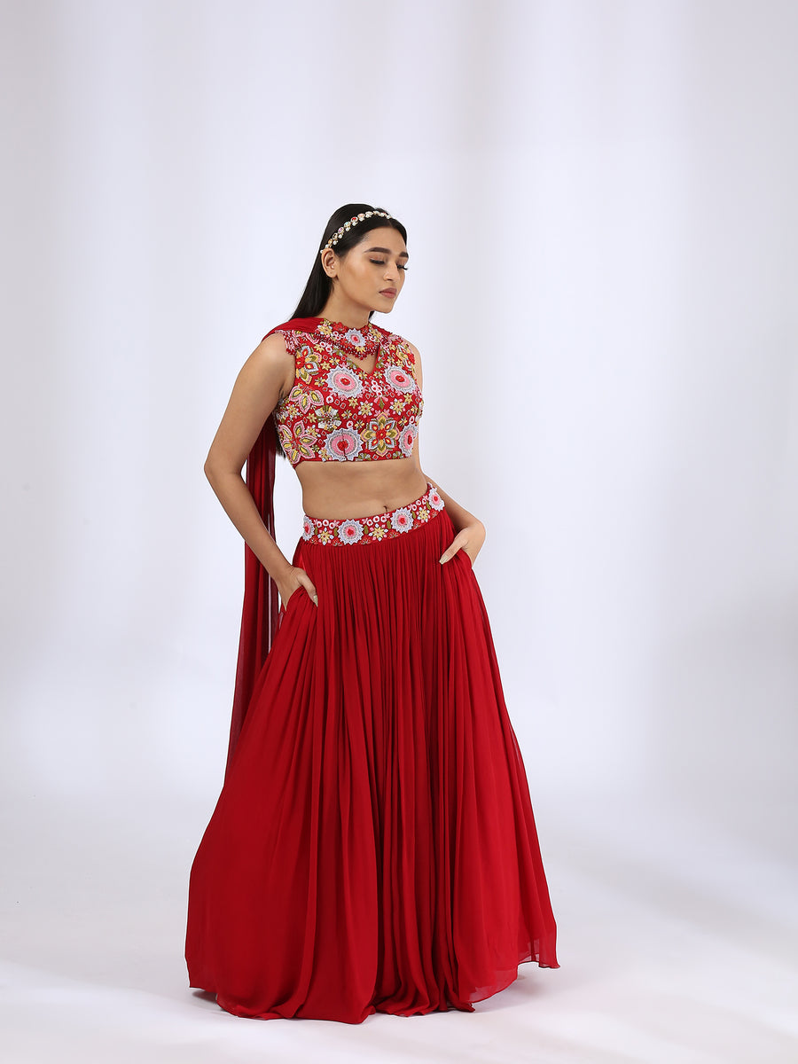 Bright Red Embroidered Choli teamed with a Pleated Lehenga and Jewelled Dupatta