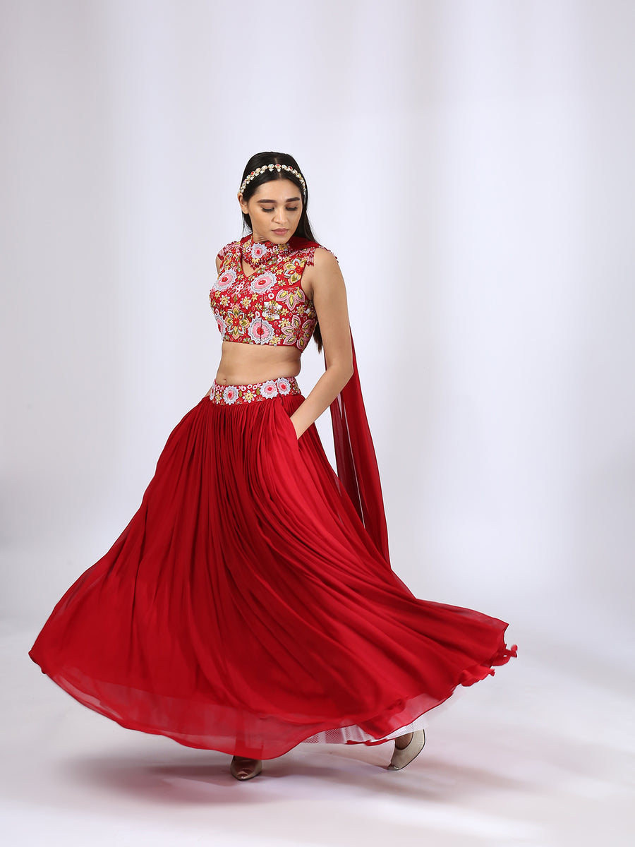 Bright Red Embroidered Choli teamed with a Pleated Lehenga and Jewelled Dupatta