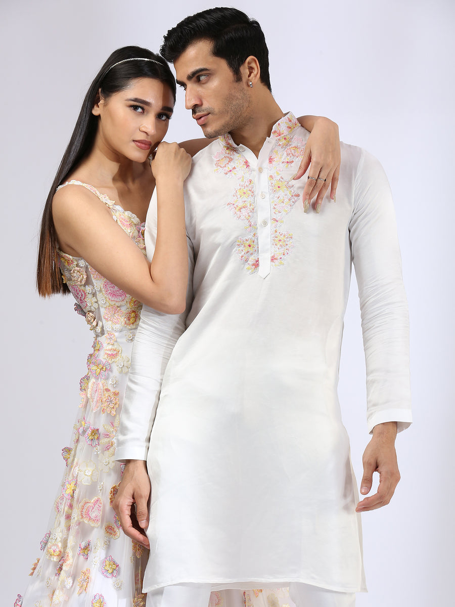 Ivory 3-D embroidered gown & Embroidered Ivory Kurta teamed with matching narrow pants