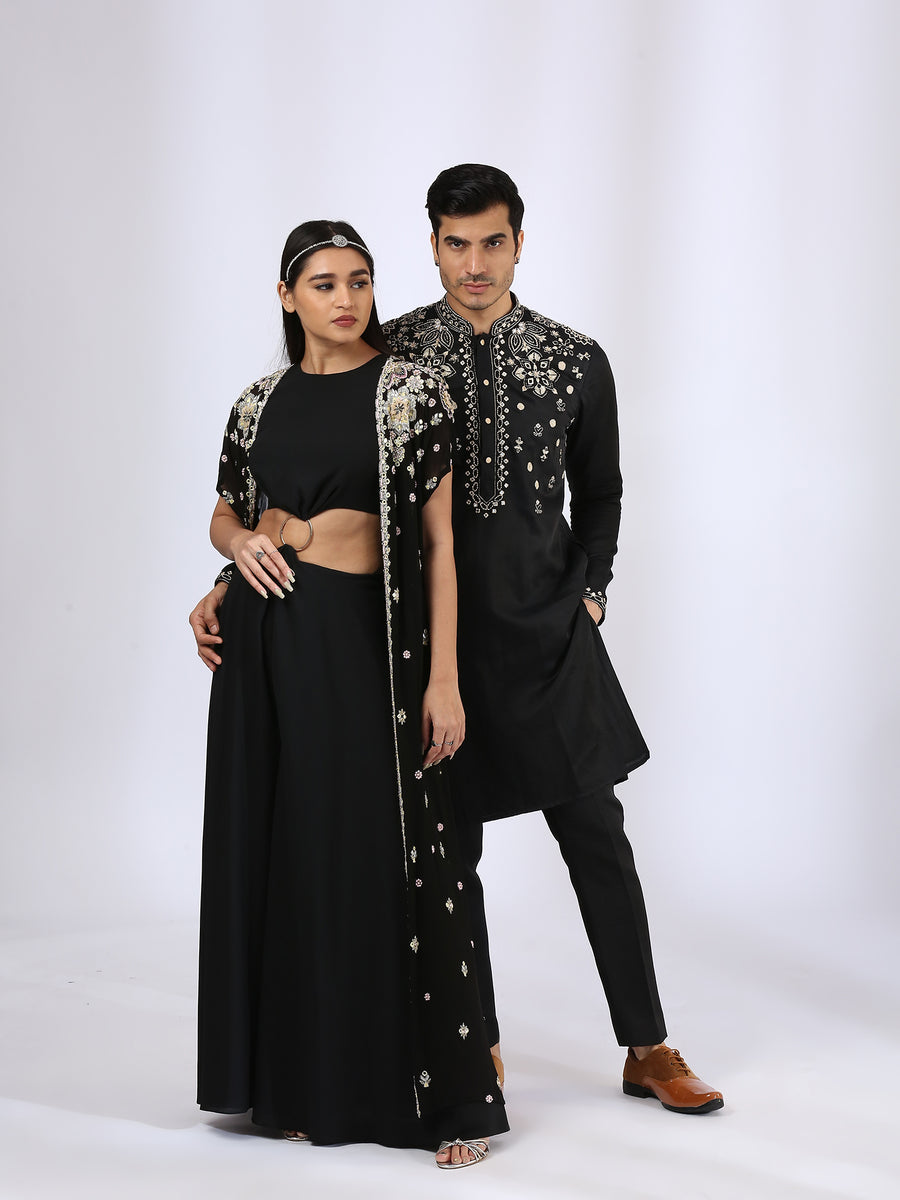 Jet black jumsuit with an embroidered open jacket & Black Embroidered Kurta teamed with matching narrow pants - Couple Set
