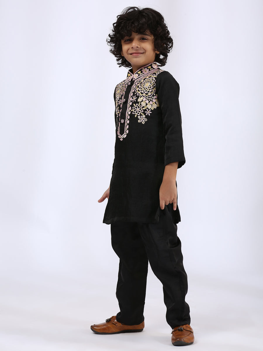 Black Embroidered Kurta teamed with matching narrow pants