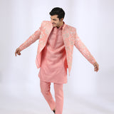 Peach Embroidered Jacket teamed with matching Kurta and Narrow Pants